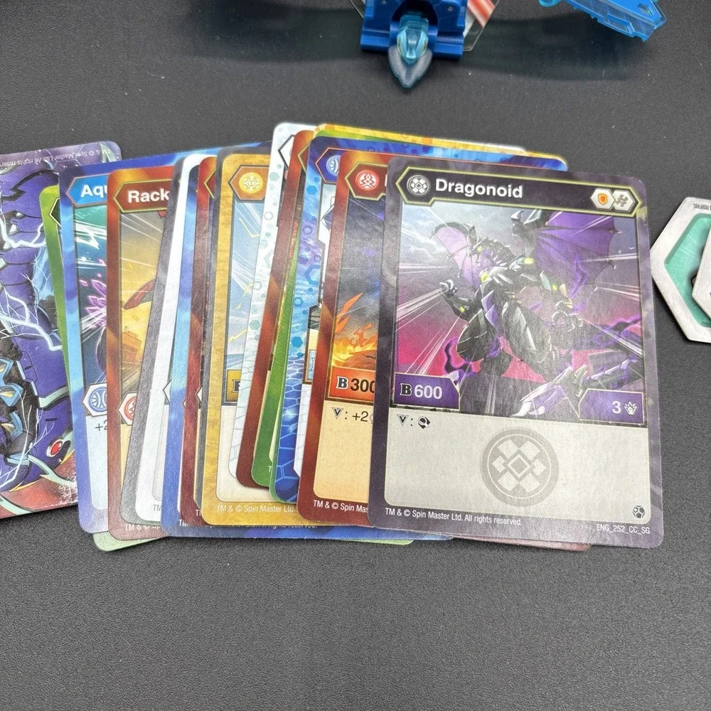 Lot Of 9 Bakugan Figures And 23 Bakugan Cards/Metal Card